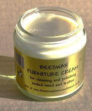 Load image into Gallery viewer, Jar of beeswax furniture cream with a golden label on a brown background